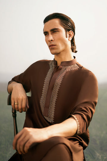 Stylish designer kurta pajama for men in a modern cut, featuring a unique kurta design perfect for formal and casual occasions.